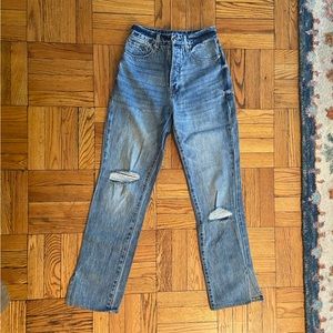 Good American blue jeans with distressed details